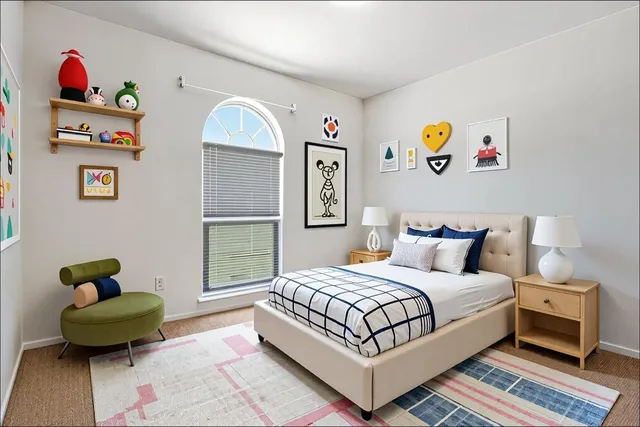 a bedroom with a bed and a couch