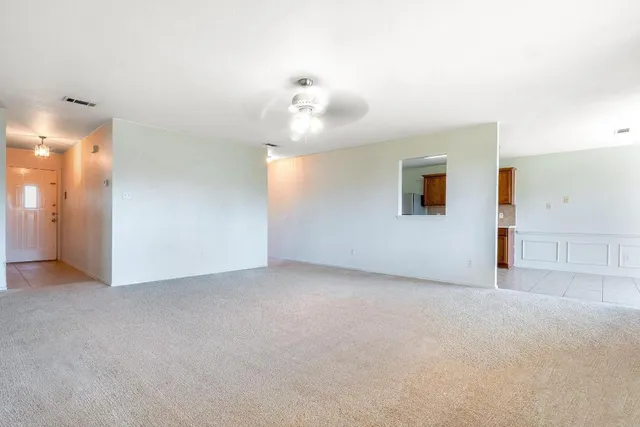 a view of an empty room with a bathroom