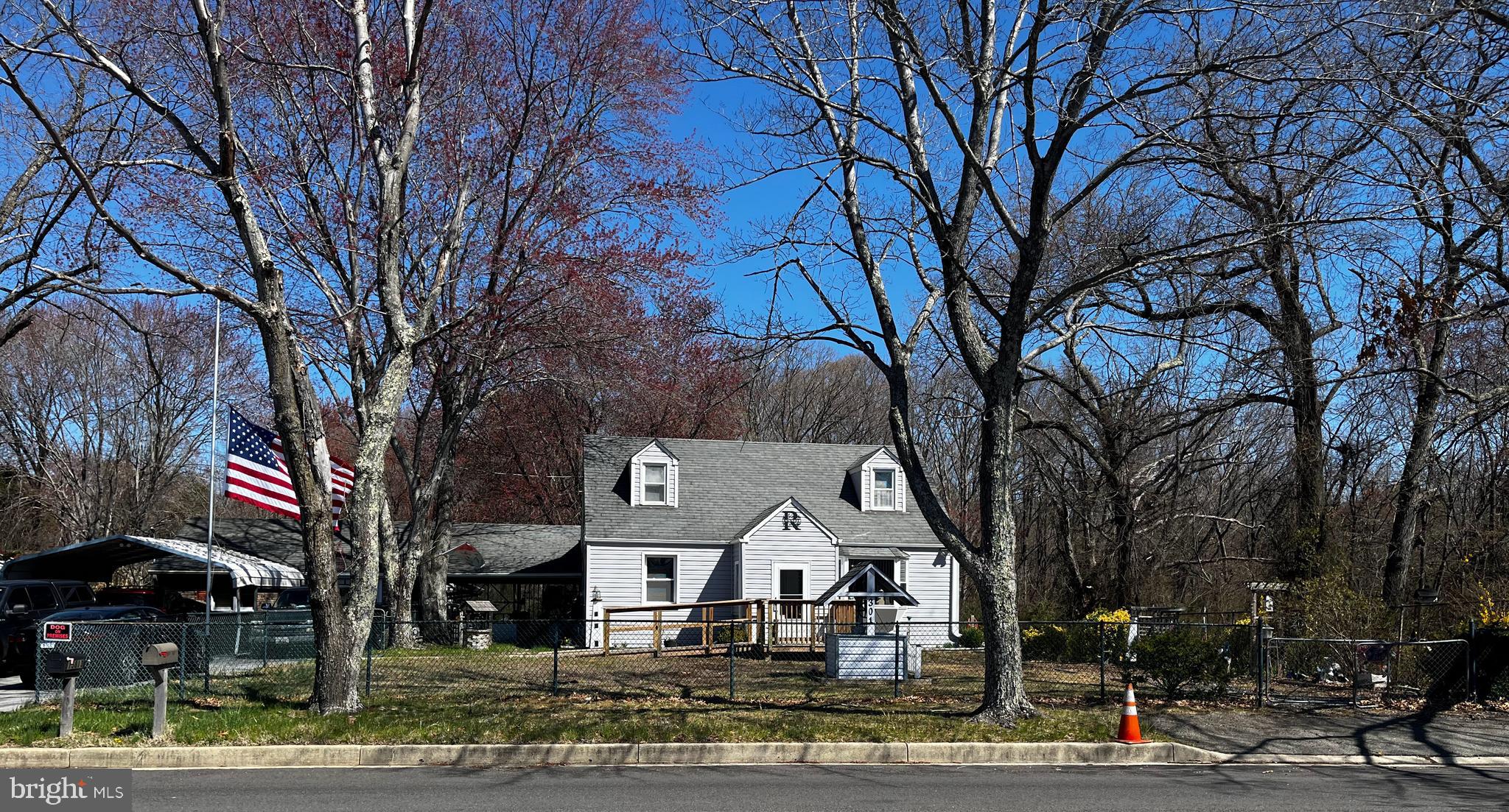 a front view of a building with trees