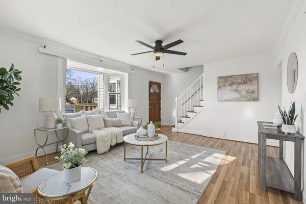 a kitchen with granite countertop white cabinets and stainless steel appliances