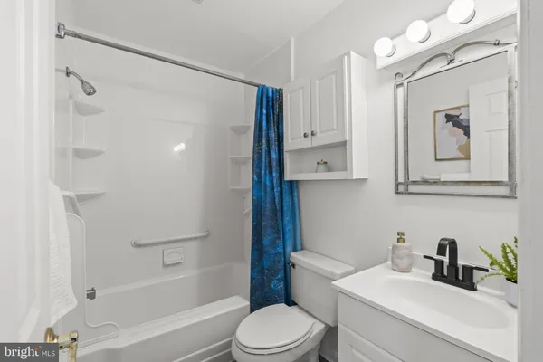 a view of a room with wooden floor and window
