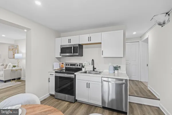 a view of a house with a yard covered in snow