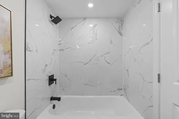 a view of a house with a yard and snow