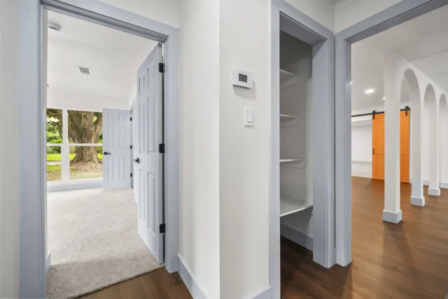 wooden floor with white walls