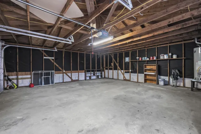 a view of an empty room with wooden roof