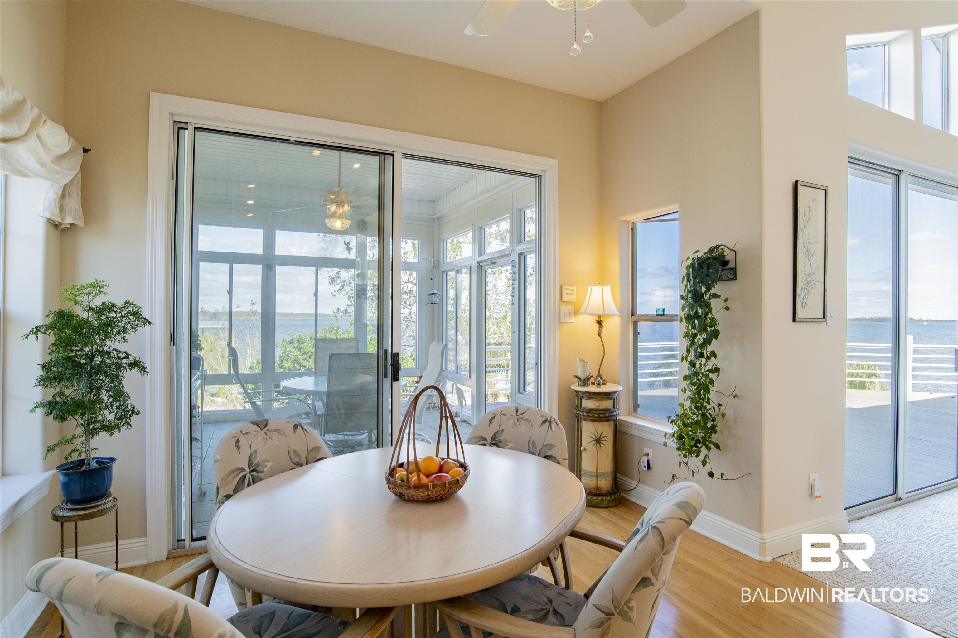 24615 Gulf Bay Road Orange Beach, AL 36561 - Photo 13 of 47 EATING AREA, SLIDING DOOR LEADS TO SUNROOM
