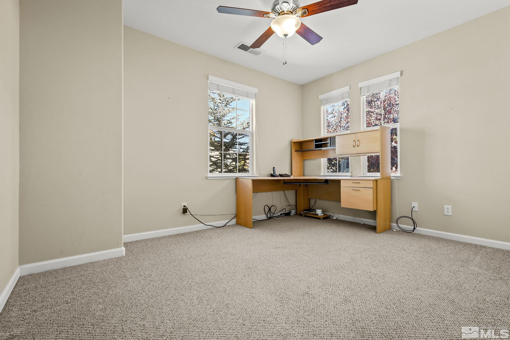 7688 Stone Bluff Way Reno, NV 89523 - Photo 20 of 26 a view of an empty room with a window