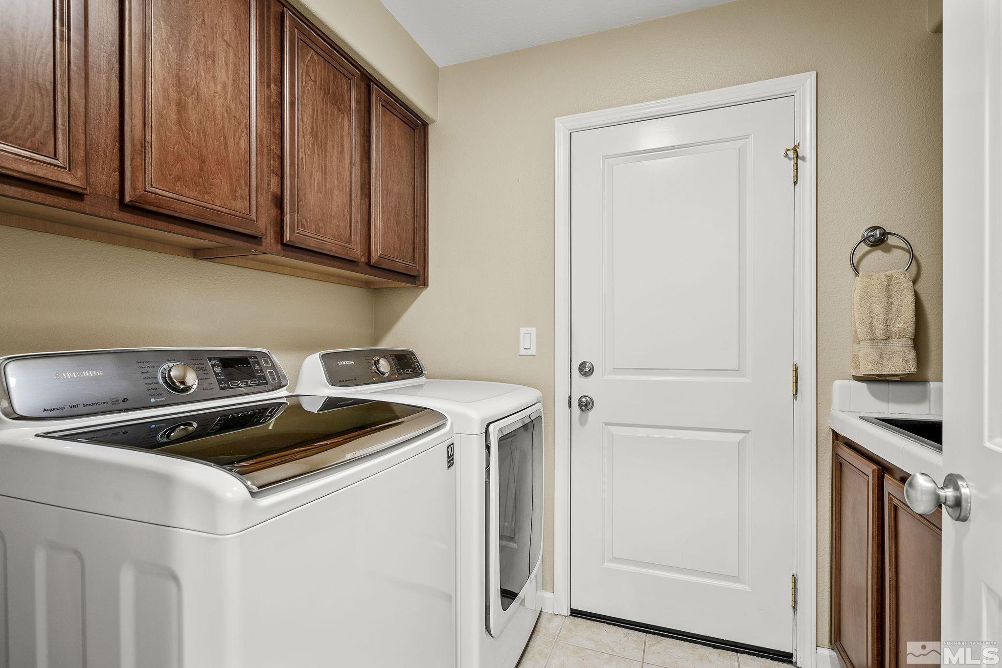 7688 Stone Bluff Way Reno, NV 89523 - Photo 23 of 26 a utility room with dryer and washer