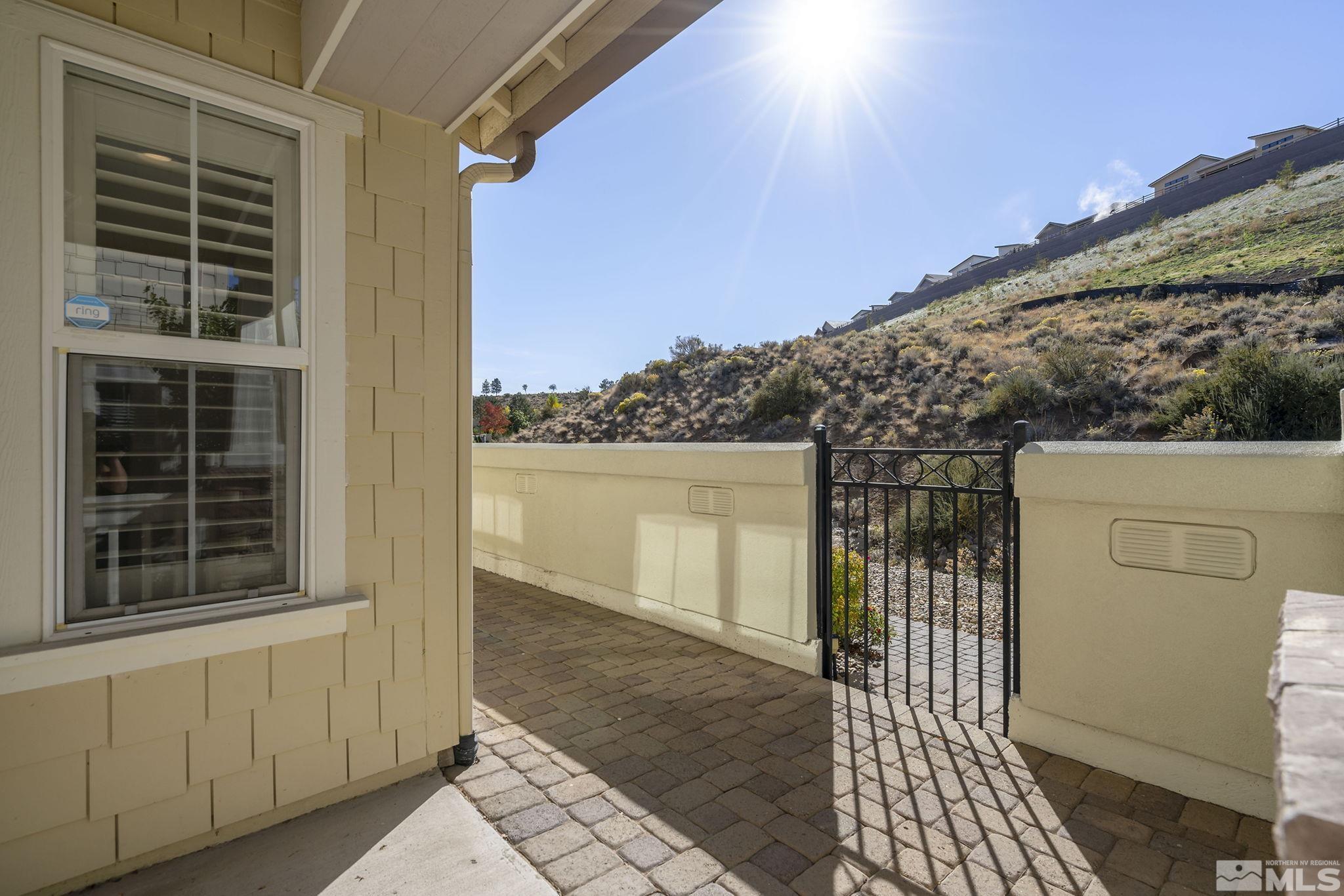 7688 Stone Bluff Way Reno, NV 89523 - Photo 26 of 26 a view of a house with a door and wooden floor