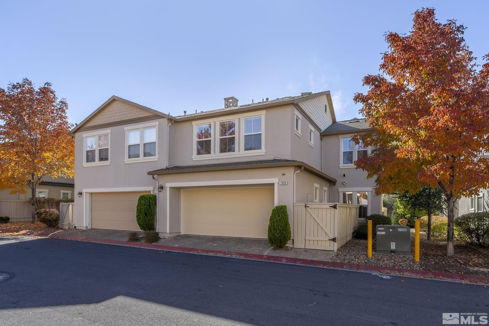 7688 Stone Bluff Way Reno, NV 89523 - Photo 3 of 26 a front view of a house with a garage