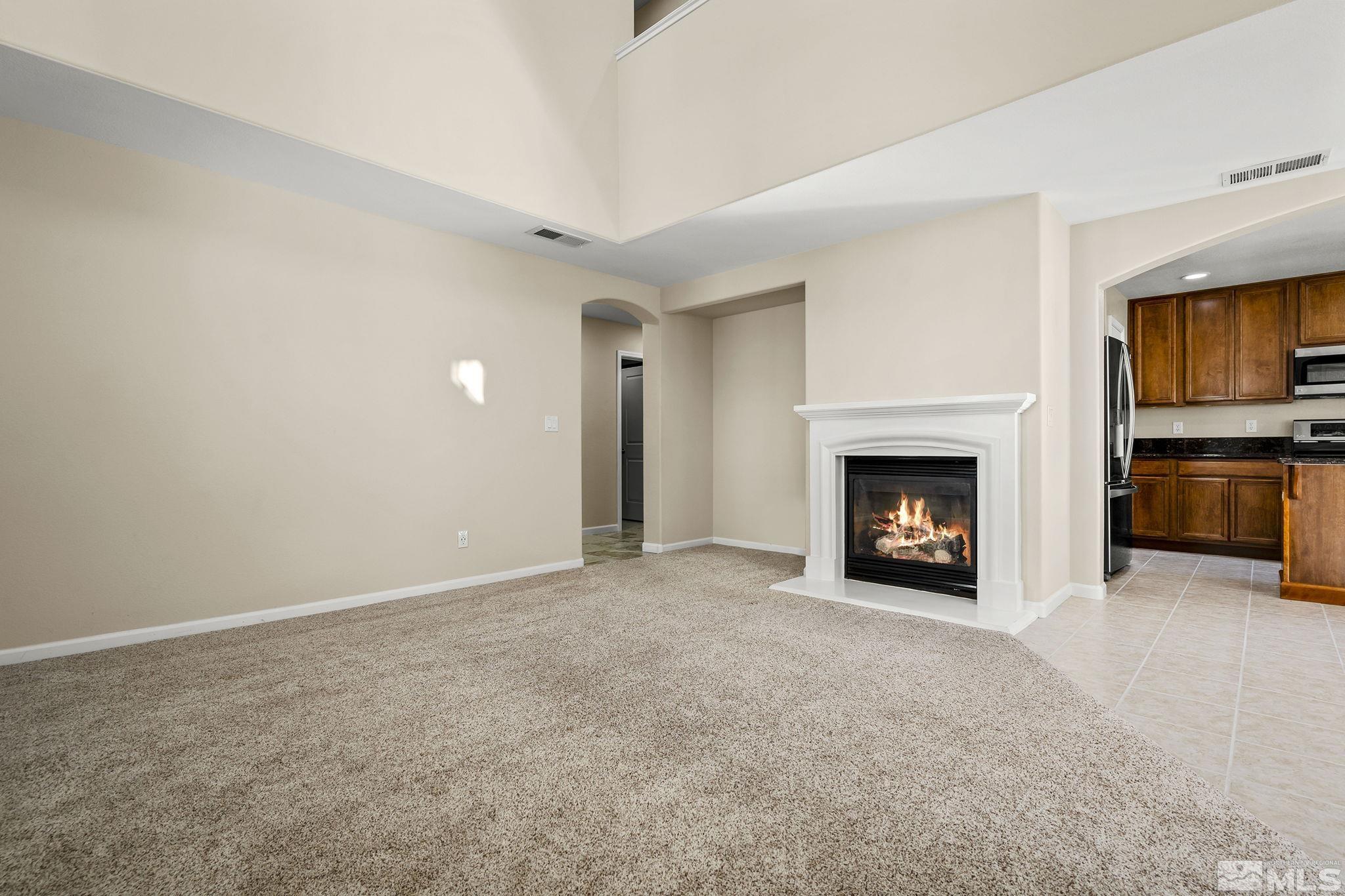 7688 Stone Bluff Way Reno, NV 89523 - Photo 4 of 26 a view of an empty room with a fireplace