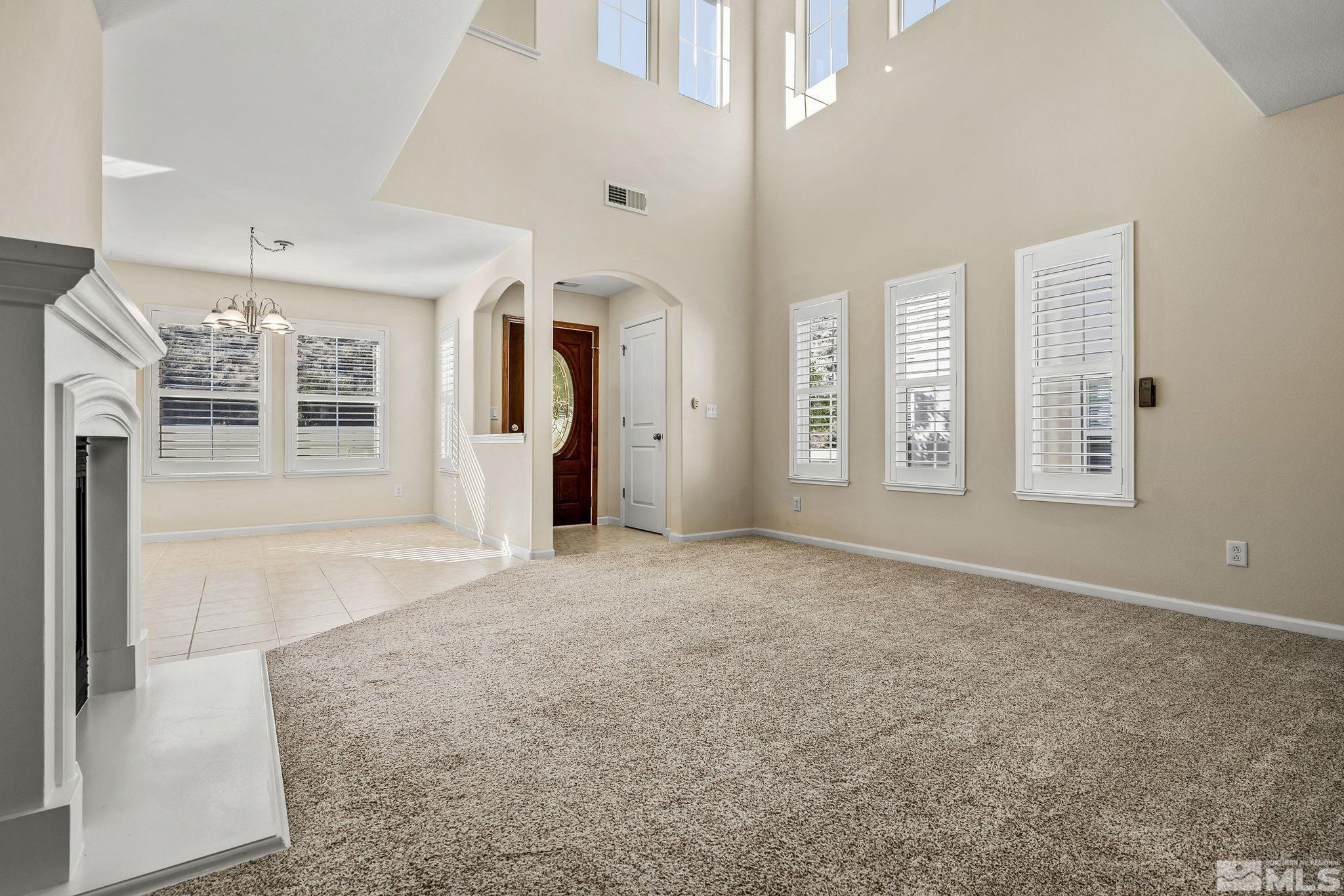 7688 Stone Bluff Way Reno, NV 89523 - Photo 6 of 26 an empty room with windows and closet