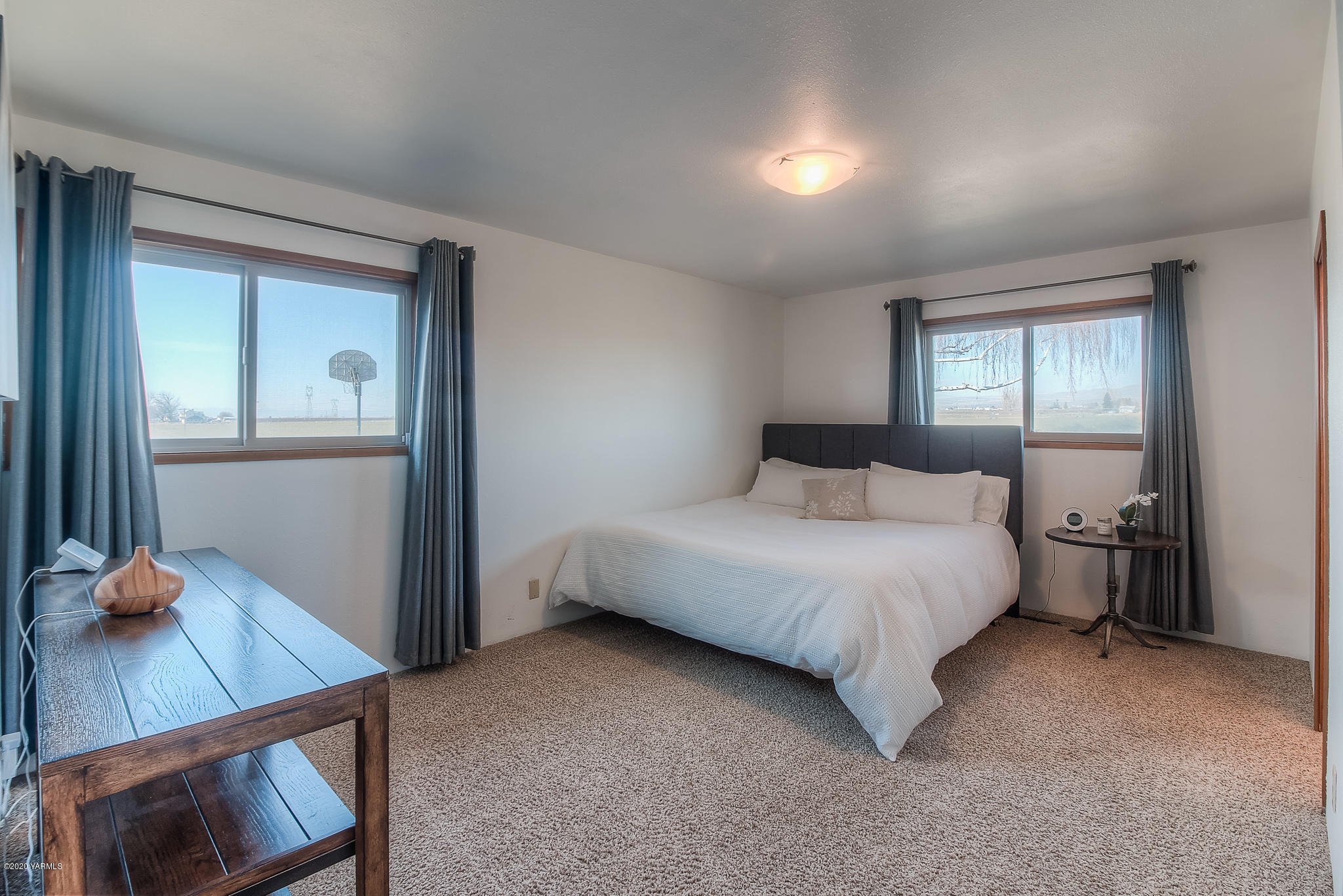 4970 Hudson Road Outlook, WA 98938 - Photo 15 of 38 a bedroom with a bed and window