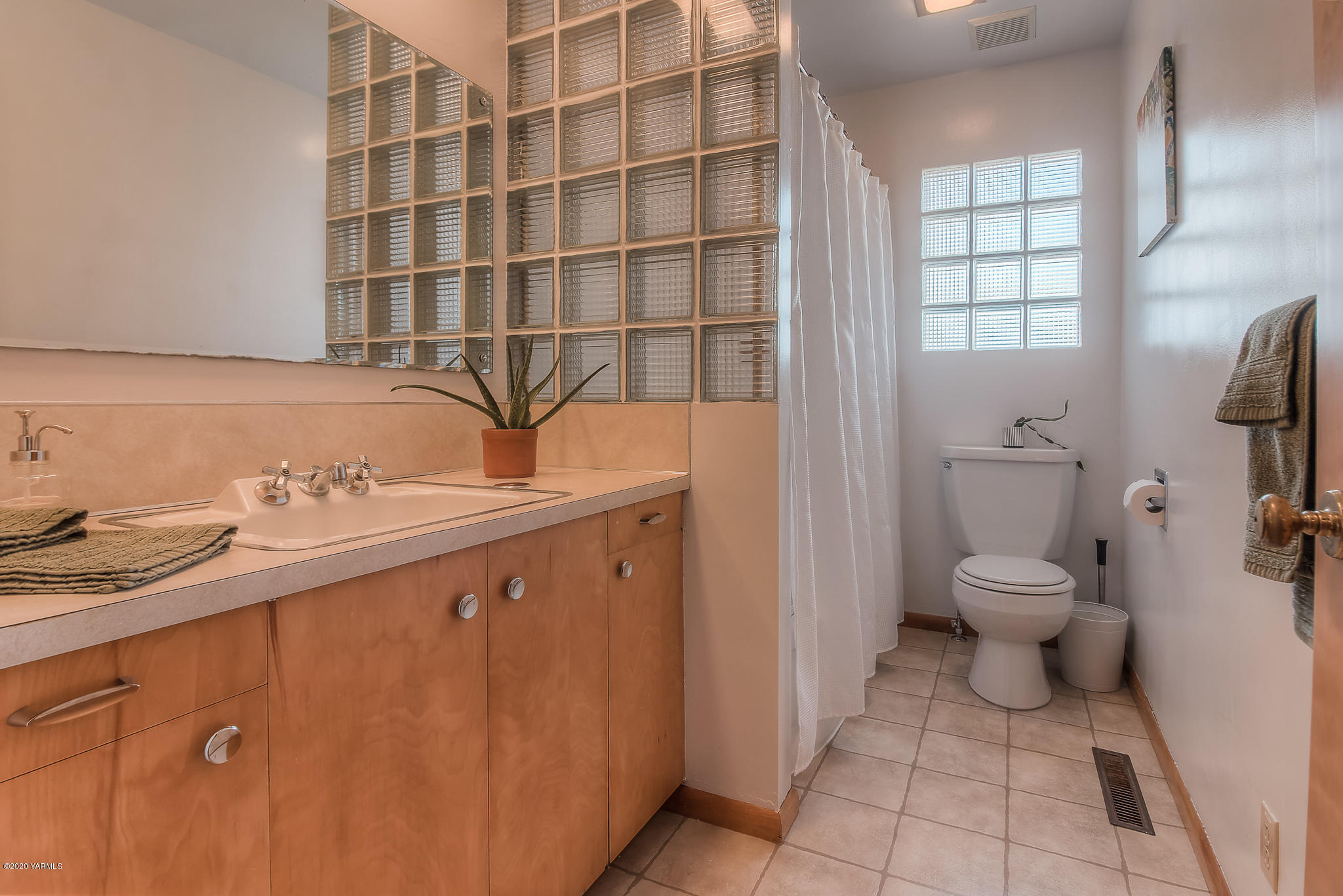 4970 Hudson Road Outlook, WA 98938 - Photo 19 of 38 a bathroom with a granite countertop sink a toilet and a mirror