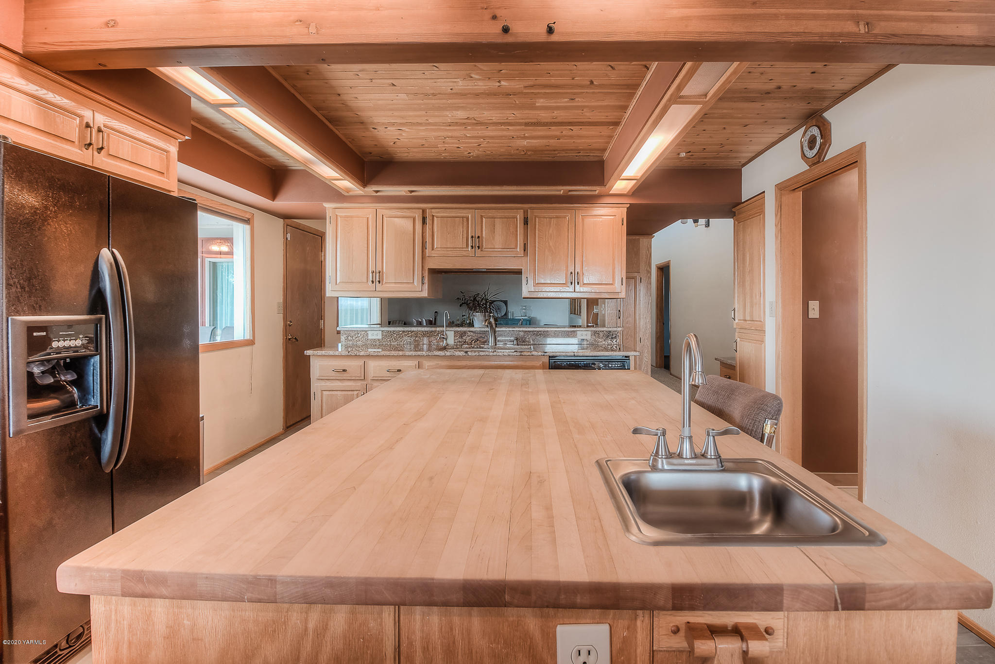 4970 Hudson Road Outlook, WA 98938 - Photo 9 of 38 a kitchen with stainless steel appliances granite countertop a refrigerator a sink and a stove
