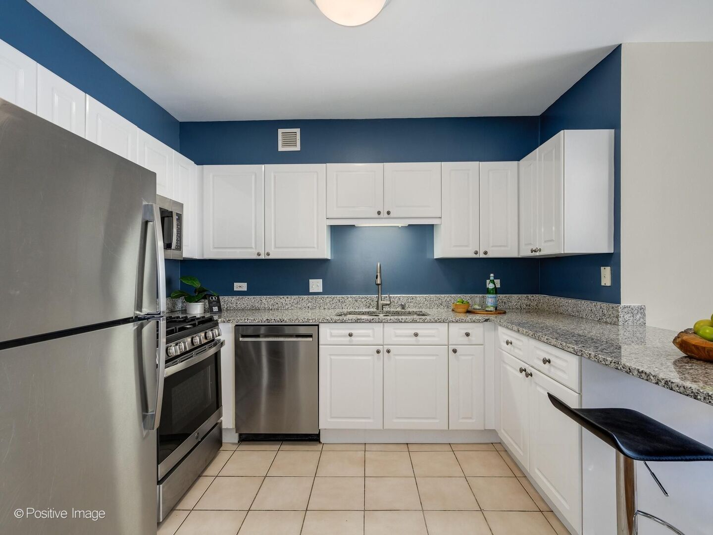 21 West Chestnut Street, Unit 901 Chicago, IL 60610 - Photo 13 of 29 a kitchen with white cabinets stainless steel appliances and a sink