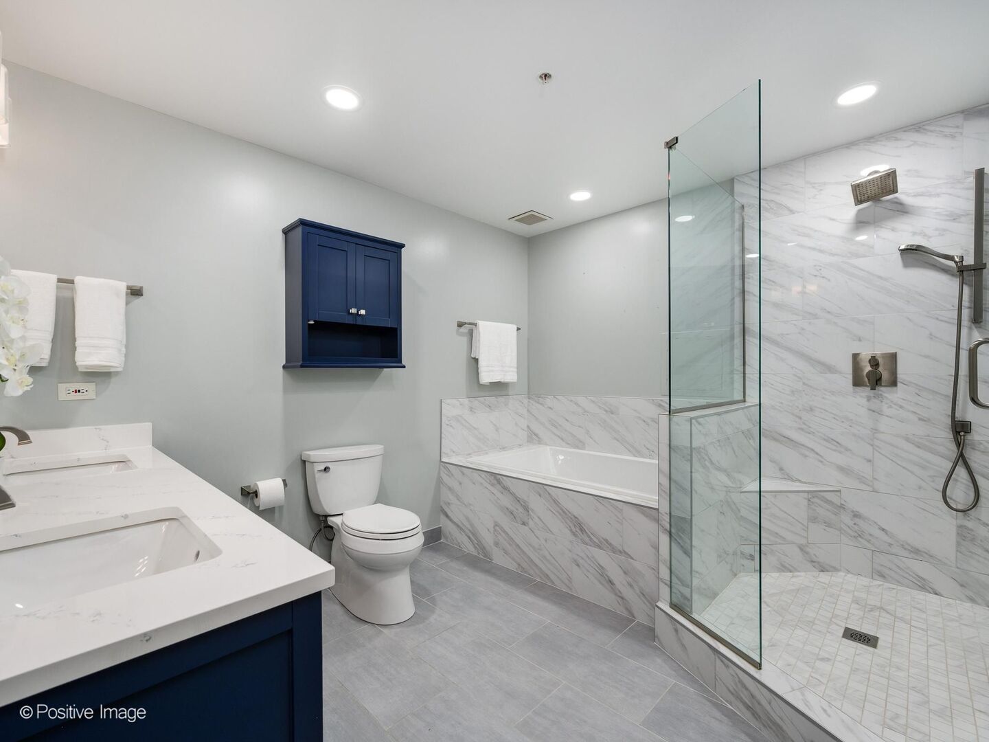 21 West Chestnut Street, Unit 901 Chicago, IL 60610 - Photo 16 of 29 a bathroom with a sink a toilet and shower