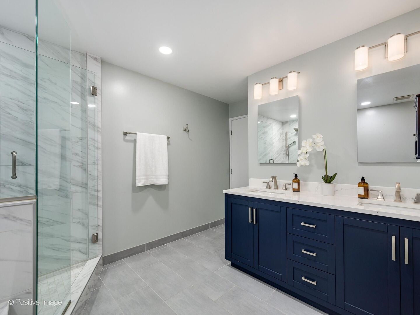 21 West Chestnut Street, Unit 901 Chicago, IL 60610 - Photo 17 of 29 a bathroom with a double vanity sink mirror and shower