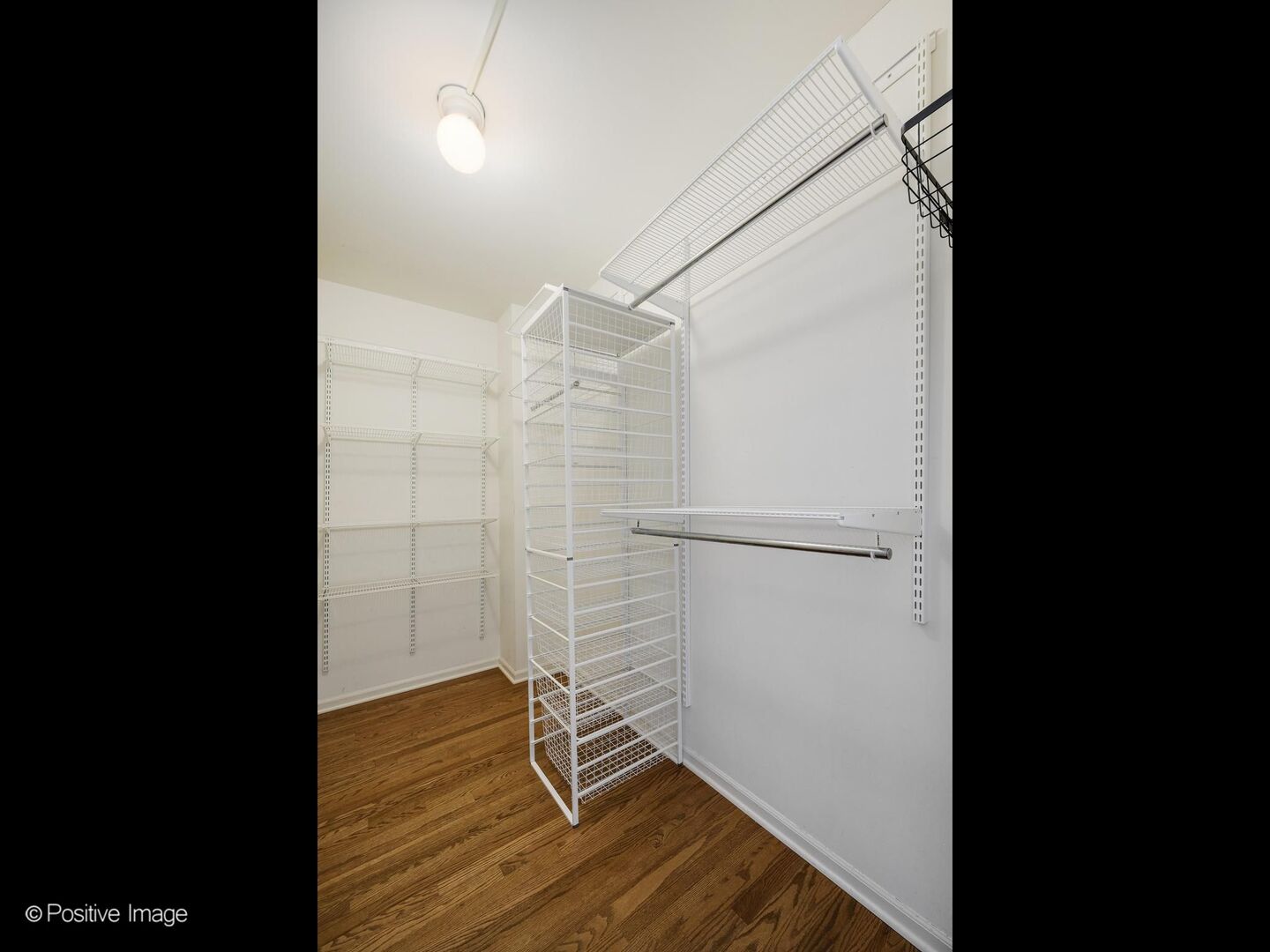 21 West Chestnut Street, Unit 901 Chicago, IL 60610 - Photo 19 of 29 a view of a room with wooden floor