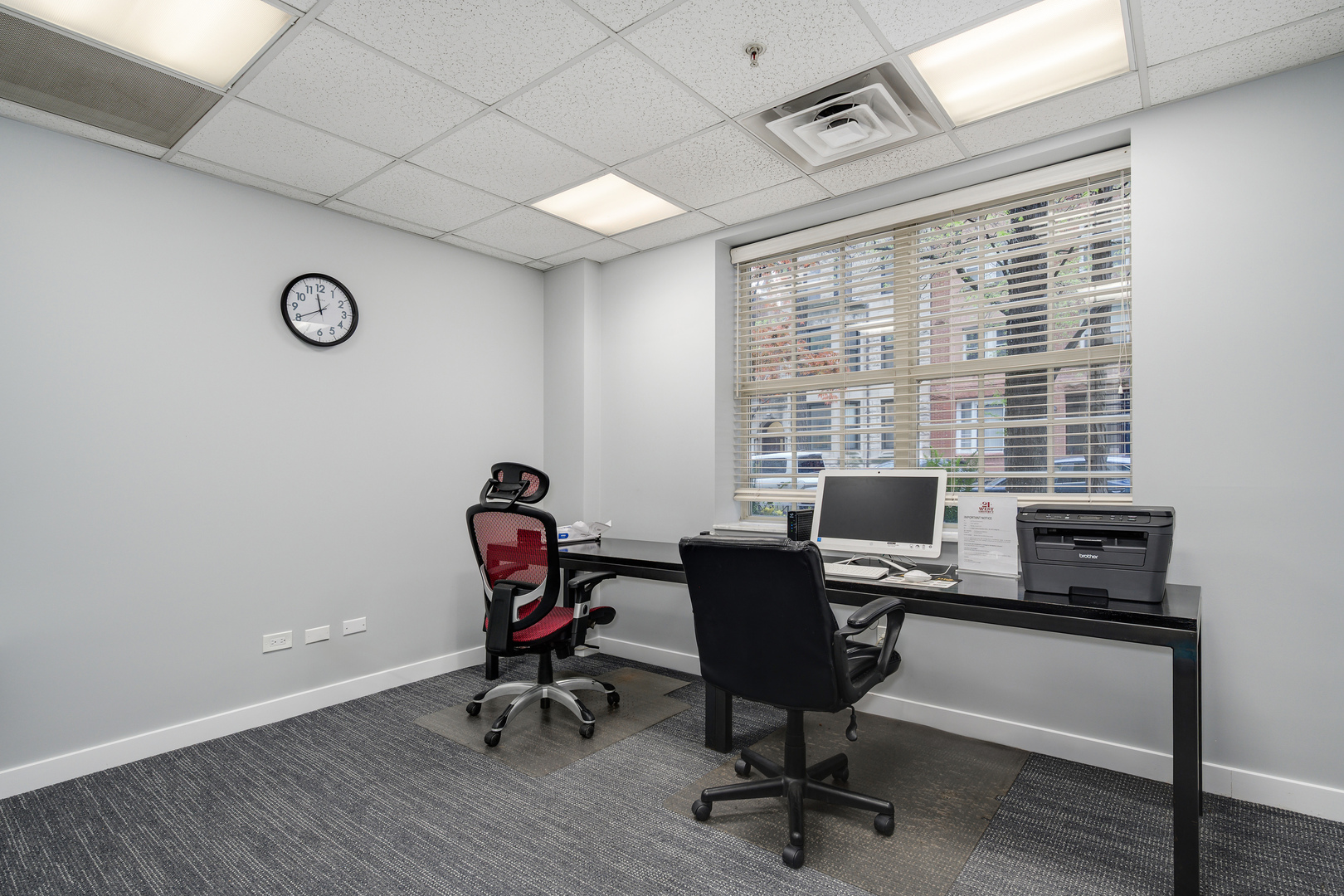 21 West Chestnut Street, Unit 901 Chicago, IL 60610 - Photo 28 of 29 a view of a workspace with furniture and a window