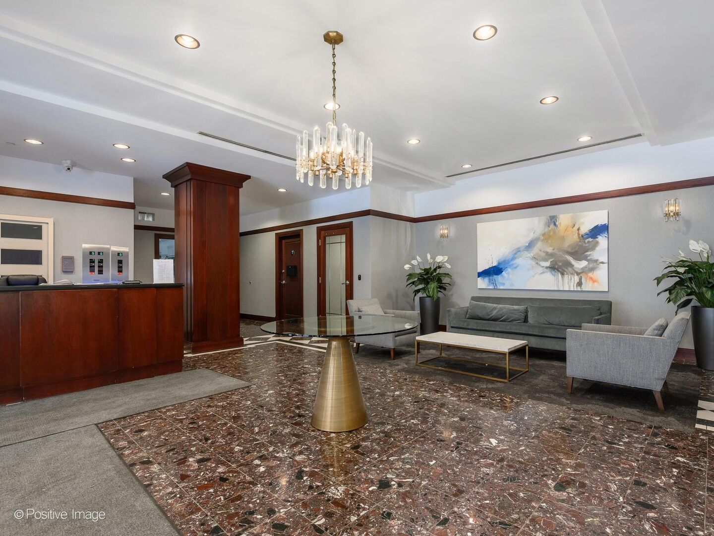 21 West Chestnut Street, Unit 901 Chicago, IL 60610 - Photo 3 of 29 a lobby with furniture and a chandelier