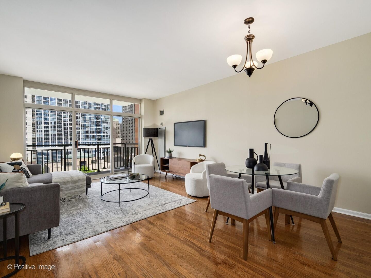 21 West Chestnut Street, Unit 901 Chicago, IL 60610 - Photo 6 of 29 a living room with furniture a fireplace and a floor to ceiling window