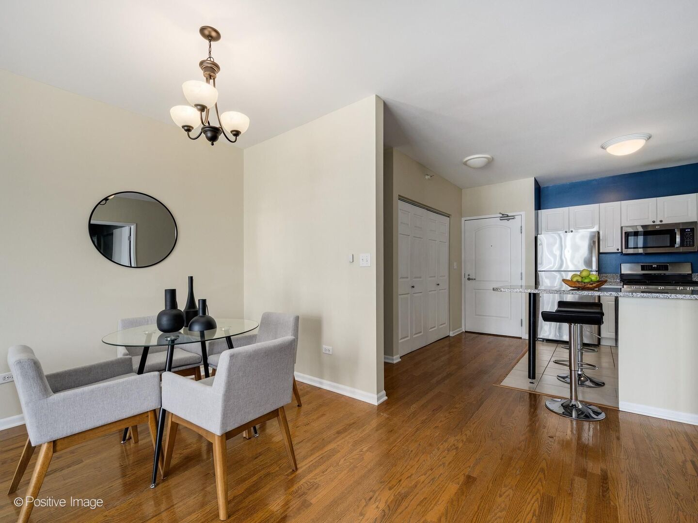 21 West Chestnut Street, Unit 901 Chicago, IL 60610 - Photo 10 of 29 a living room with furniture a dining table and a rug