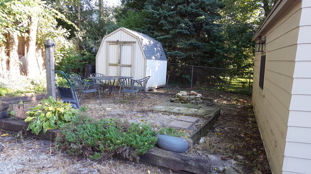 829 North Bennett Street Geneva, IL 60134 - Photo 20 of 20 a front view of a house with garden