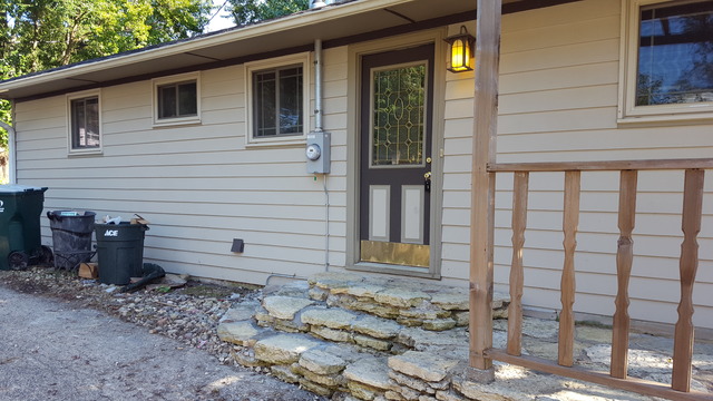829 North Bennett Street Geneva, IL 60134 - Photo 4 of 20 a view of a porch with a bench
