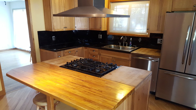 829 North Bennett Street Geneva, IL 60134 - Photo 6 of 20 a kitchen with stainless steel appliances granite countertop a sink stove and refrigerator