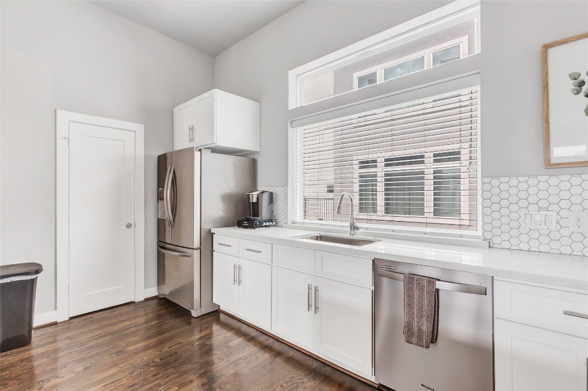 1310 Roberts Street Houston, TX 77003 - Photo 11 of 30 a kitchen with white cabinets and refrigerator