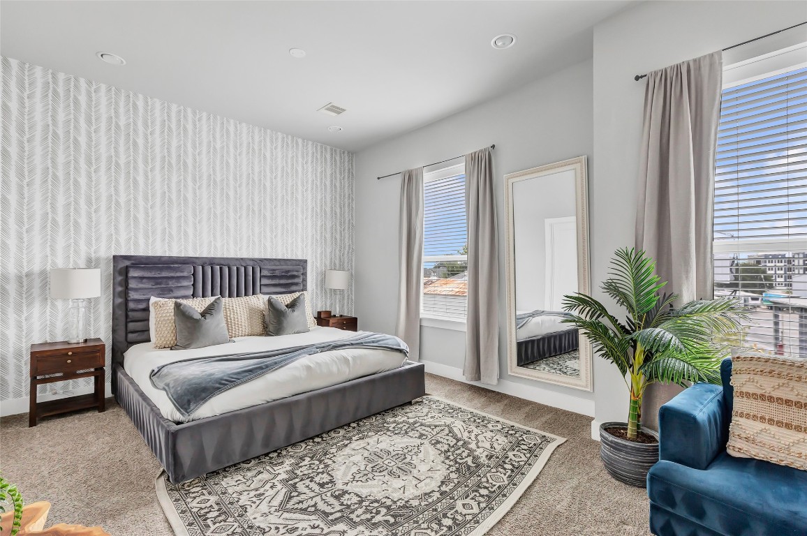 1310 Roberts Street Houston, TX 77003 - Photo 12 of 30 a bedroom with a large bed and a couch