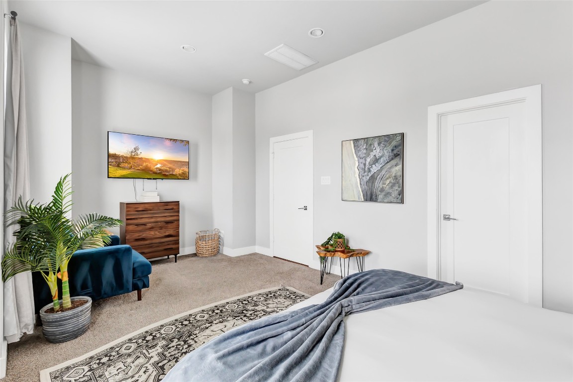 1310 Roberts Street Houston, TX 77003 - Photo 13 of 30 a bedroom with a bed and a couch