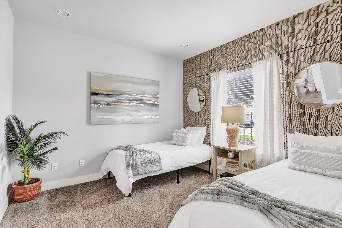 1310 Roberts Street Houston, TX 77003 - Photo 16 of 30 a bedroom with bed and a potted plant