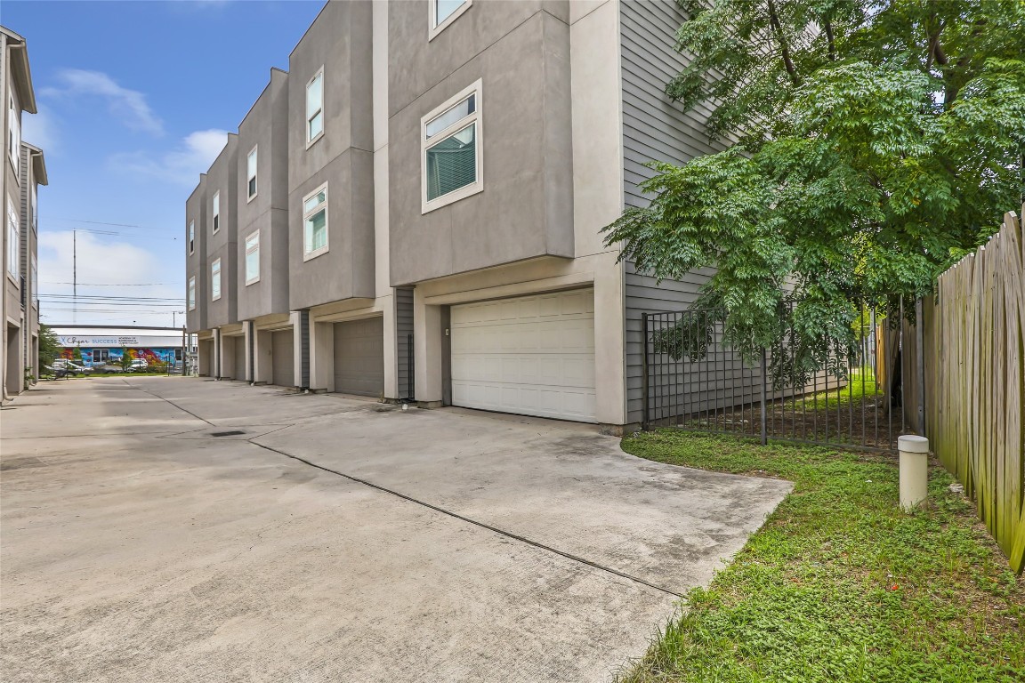 1310 Roberts Street Houston, TX 77003 - Photo 28 of 30 a view of a house with a yard and garage