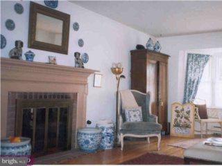 689 Vassar Road Wayne, PA 19087 - Photo 3 of 3 a living room with furniture and a fireplace