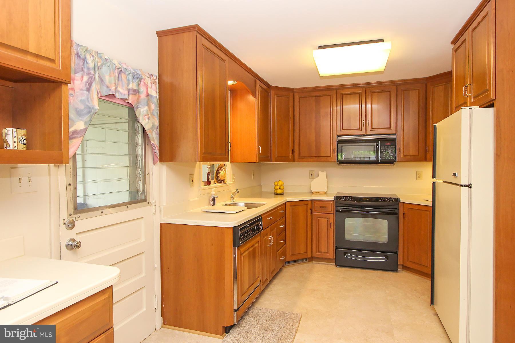 CUSTOM KITCHEN BY WATKINS, SIDE DOOR TO CARPORT