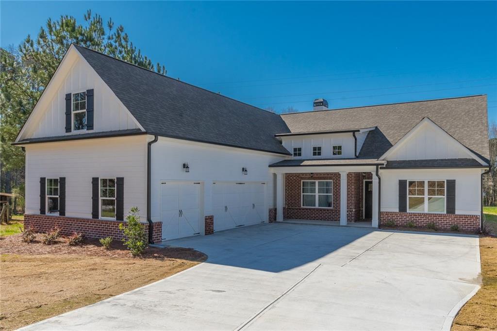 420 Carl Davis Road Northwest Monroe, GA 30656 - Photo 1 of 1 a view of a house with a backyard