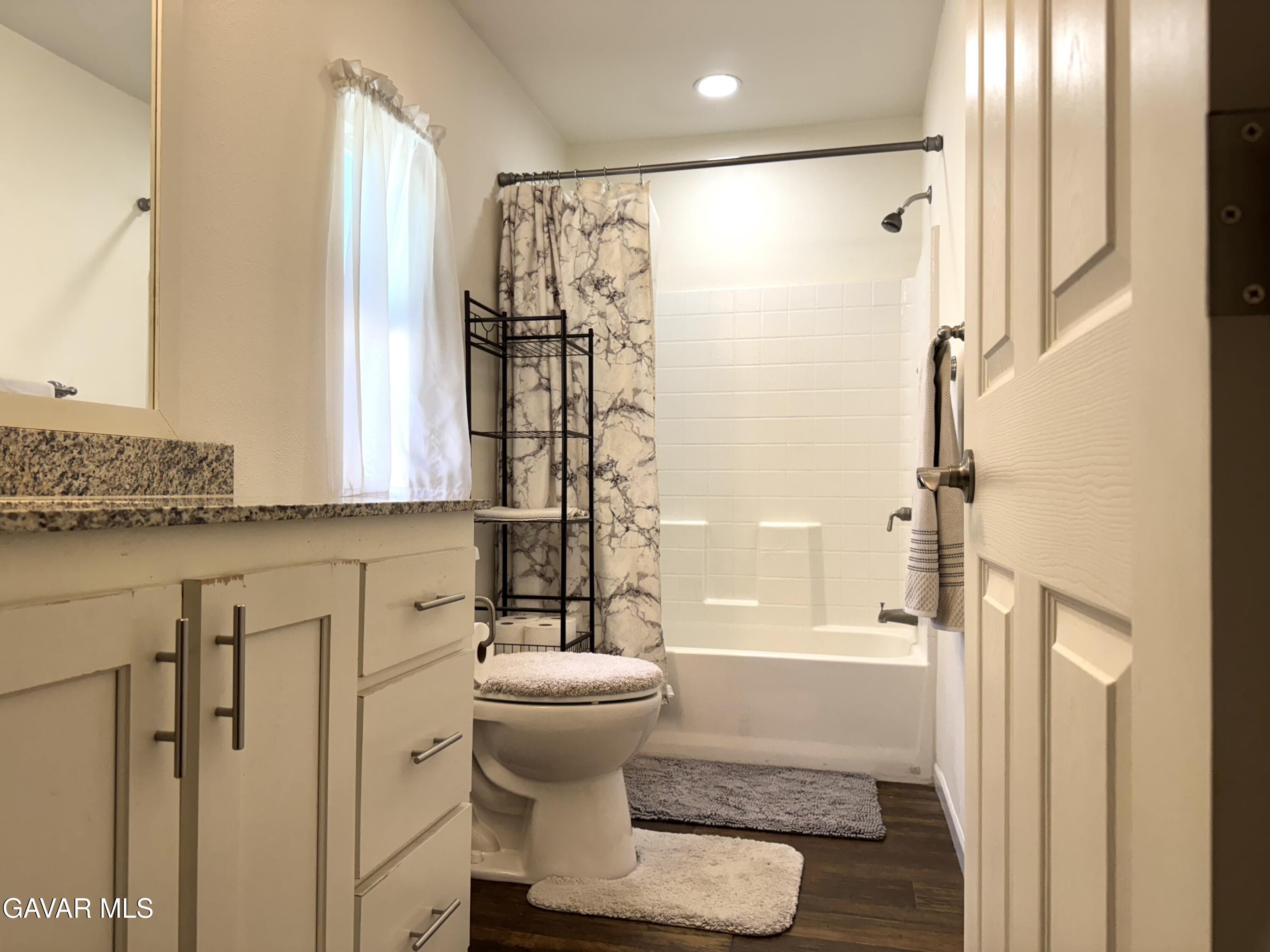 657 Lebec Road Lebec, CA 93243 - Photo 11 of 18 a bathroom with a shower and a sink