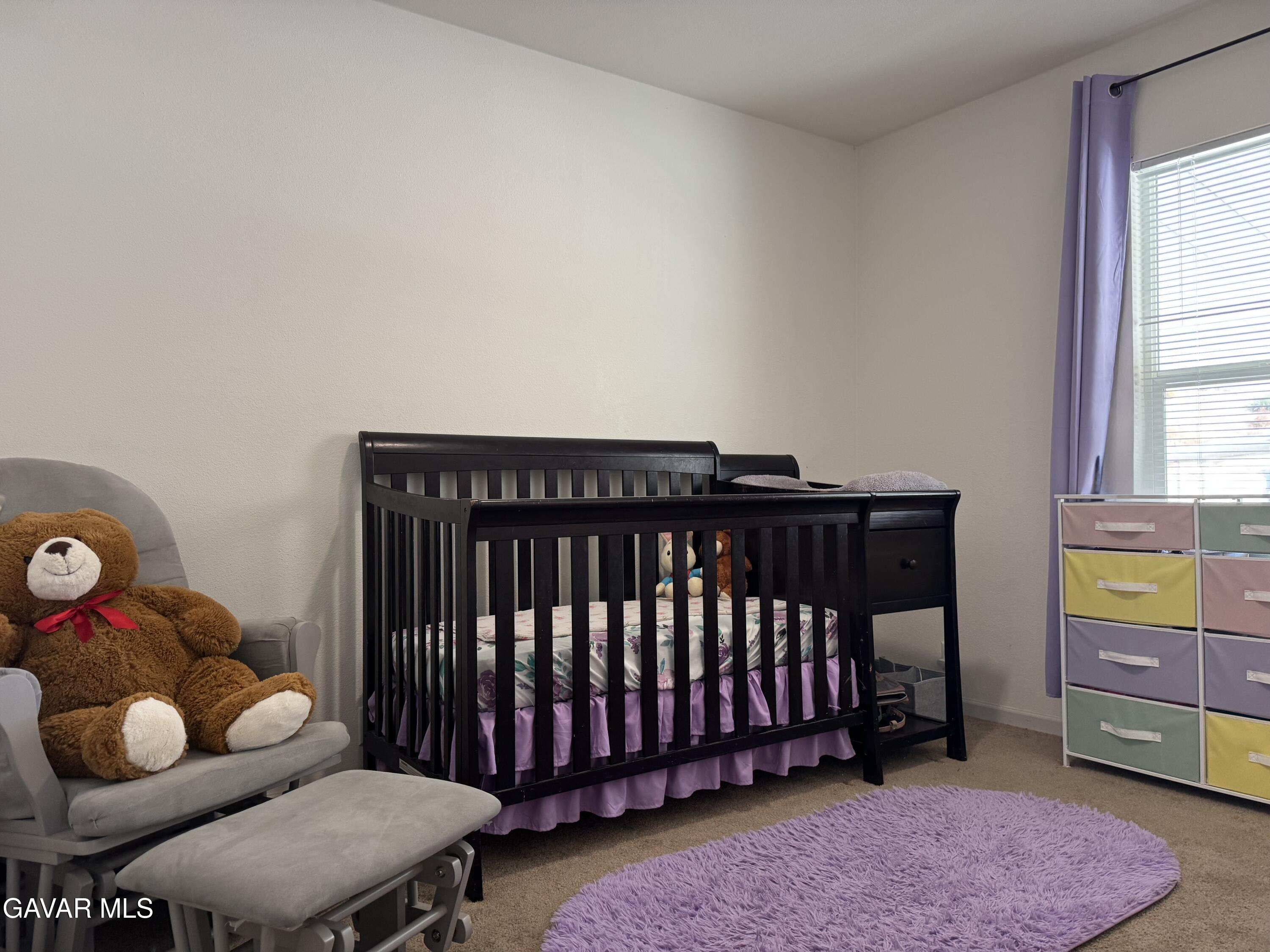 657 Lebec Road Lebec, CA 93243 - Photo 12 of 18 a bedroom with furniture and a chair