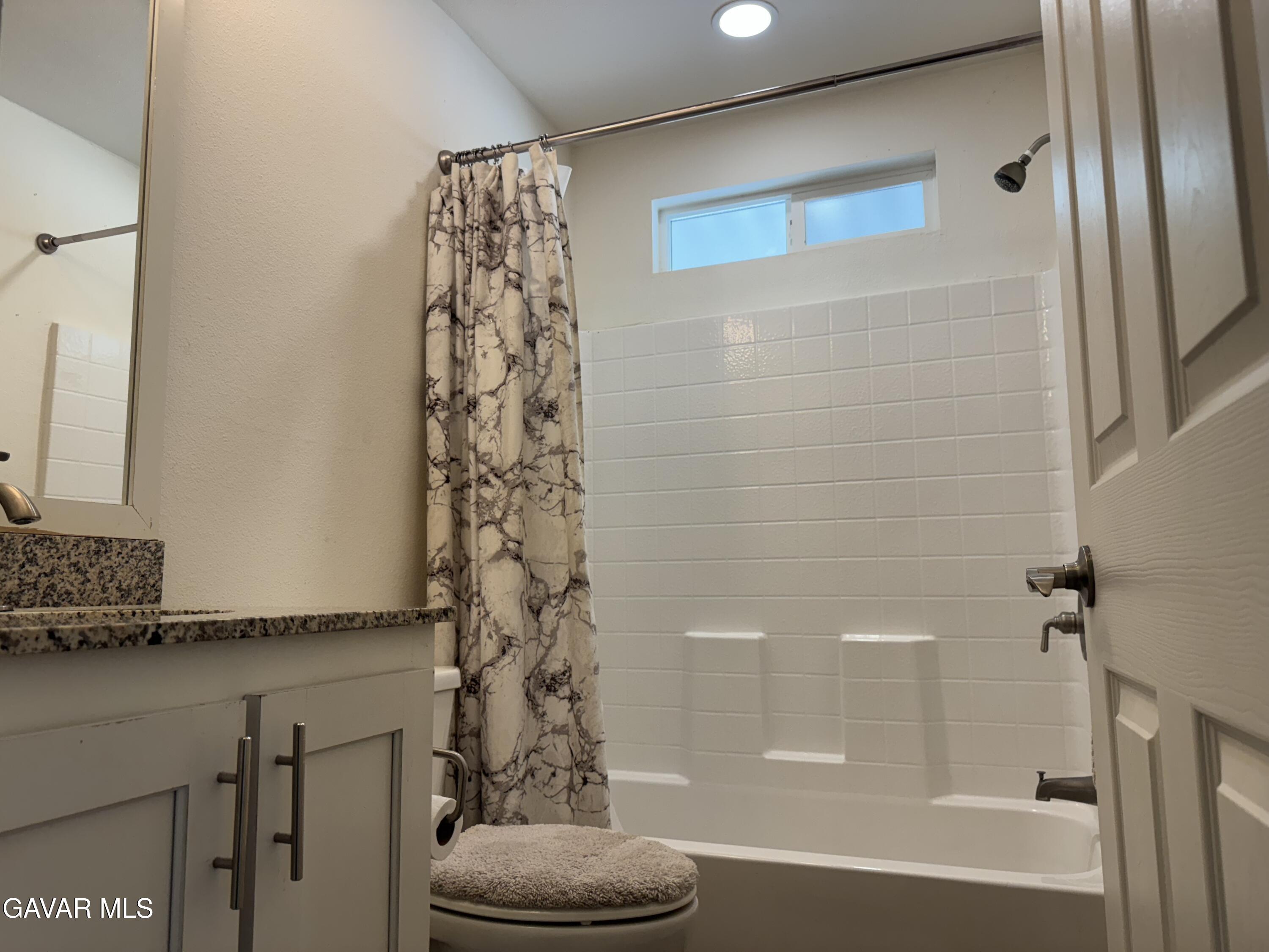 657 Lebec Road Lebec, CA 93243 - Photo 14 of 18 a bathroom with a bathtub and a shower
