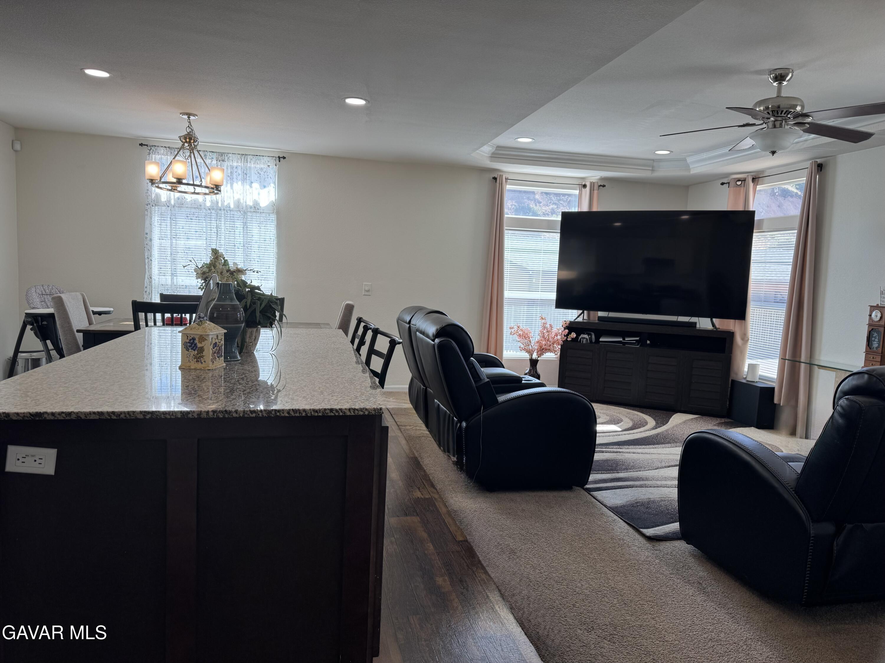 657 Lebec Road Lebec, CA 93243 - Photo 4 of 18 a living room with furniture a chandelier and a flat screen tv