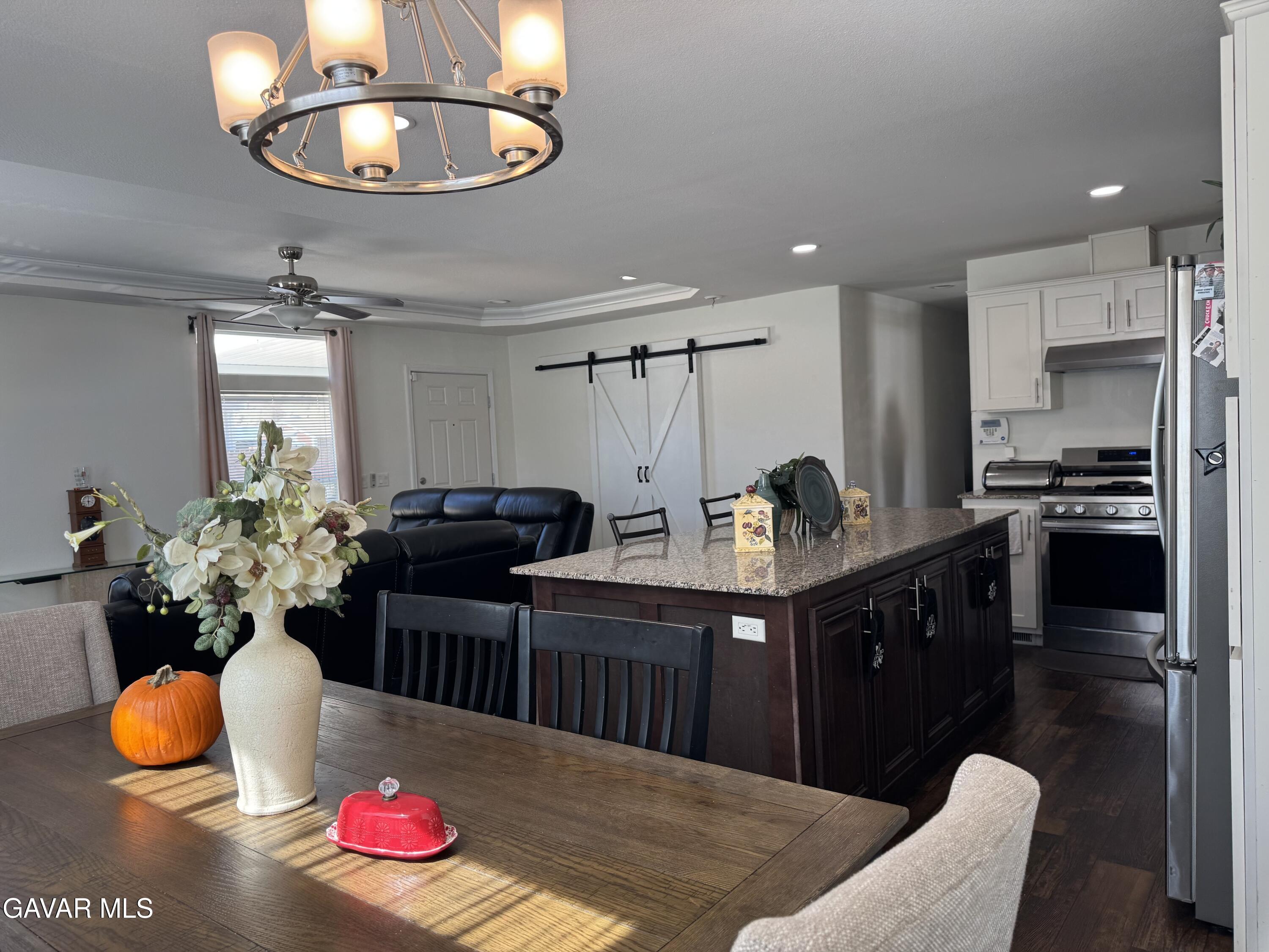 657 Lebec Road Lebec, CA 93243 - Photo 5 of 18 a kitchen with a chandelier stainless steel appliances and living room view