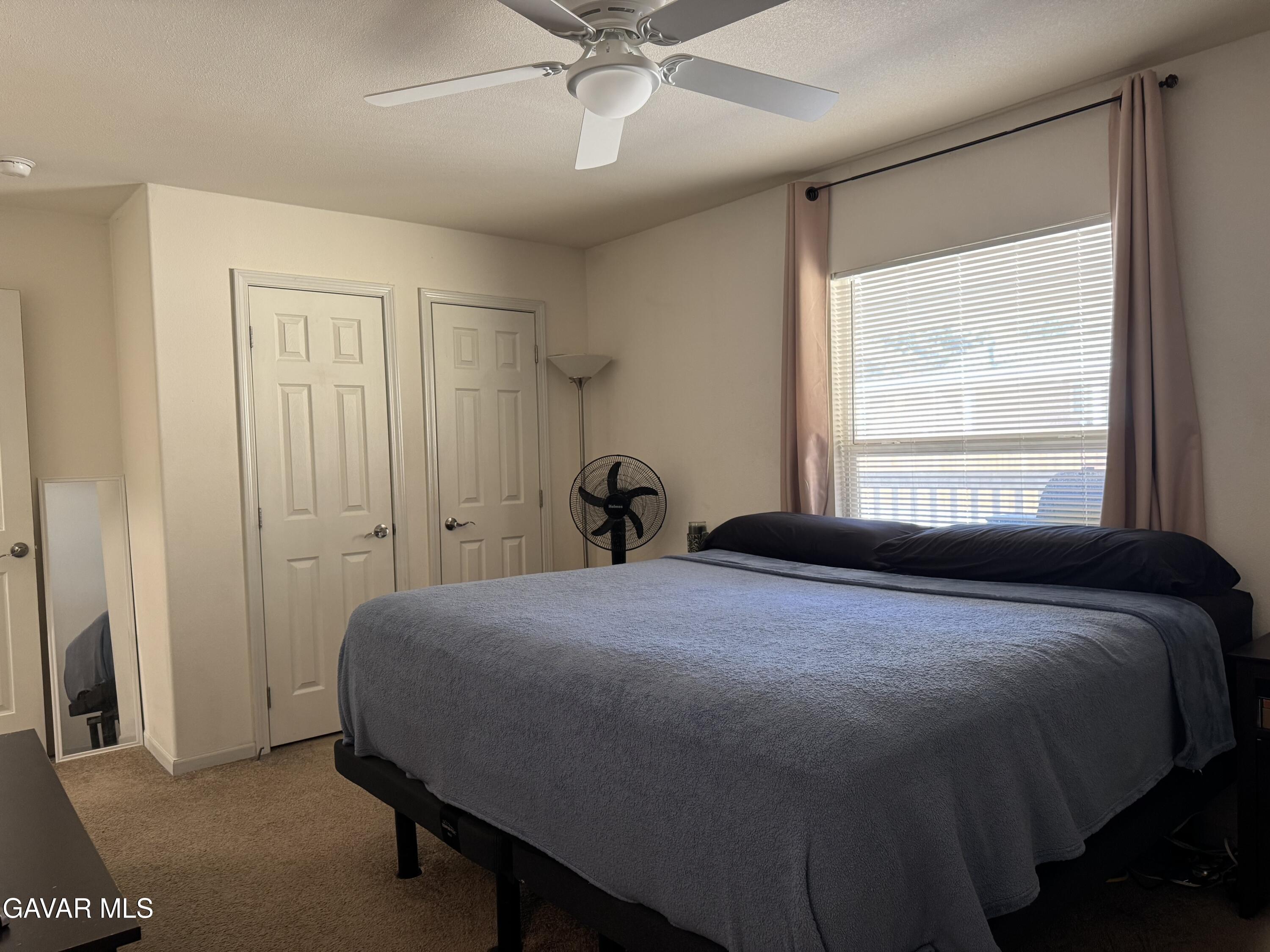 657 Lebec Road Lebec, CA 93243 - Photo 10 of 18 a bedroom with a bed and window