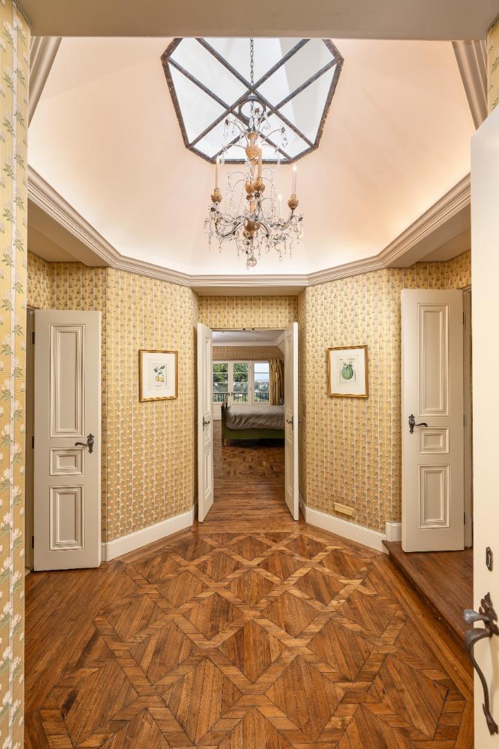3085 Ralston Avenue Hillsborough, CA 94010 - Photo 13 of 29 a view of a hallway with a chandelier