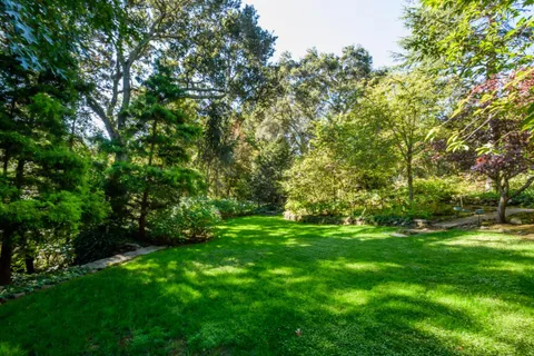 a backyard of a house with lots of green space