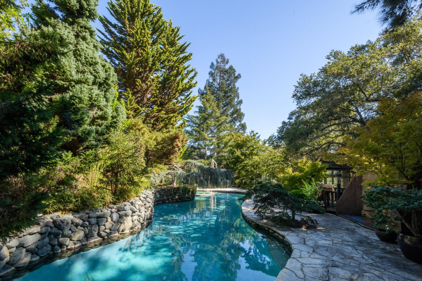 3085 Ralston Avenue Hillsborough, CA 94010 - Photo 22 of 29 a backyard of a house with lots of green space