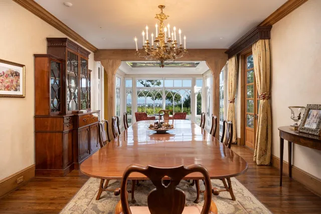 a view of a dining room with furniture window and wooden floor
