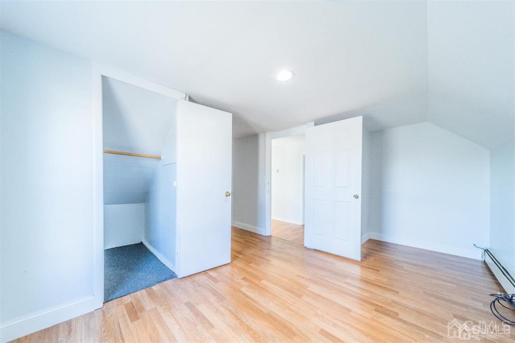 125 Lowell Street, Unit 2 Carteret, NJ 07008 - Photo 12 of 12 a view of hallway with wooden floor