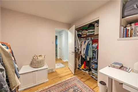 a view of a livingroom with furniture and hardwood